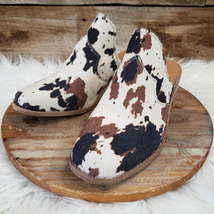 The Crown Cow Print Mules